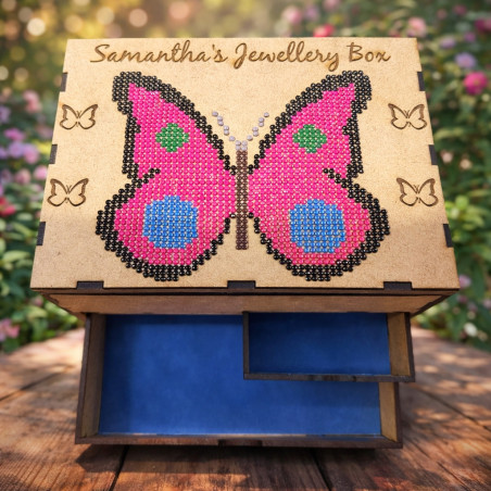 A  wooden jewellery box diamond art butterfly on the lid, featuring three drawers and multiple compartments.