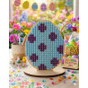 Miniature DIY diamond art Easter egg with blue and dark purple polka dot design,